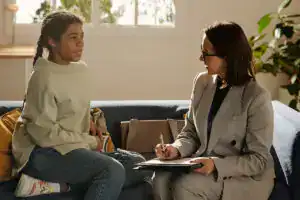 Woman in assessment with a young person